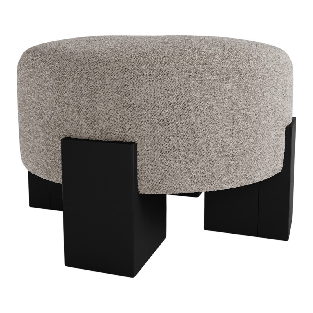 Round light gray ottoman with textured fabric and bold black wooden legs. Perfect for modern decor.
