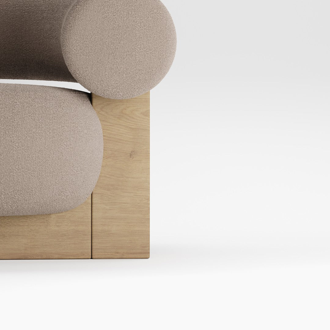 Beige upholstered sofa with rounded armrests and natural wood base, featuring a smooth, minimalistic design.