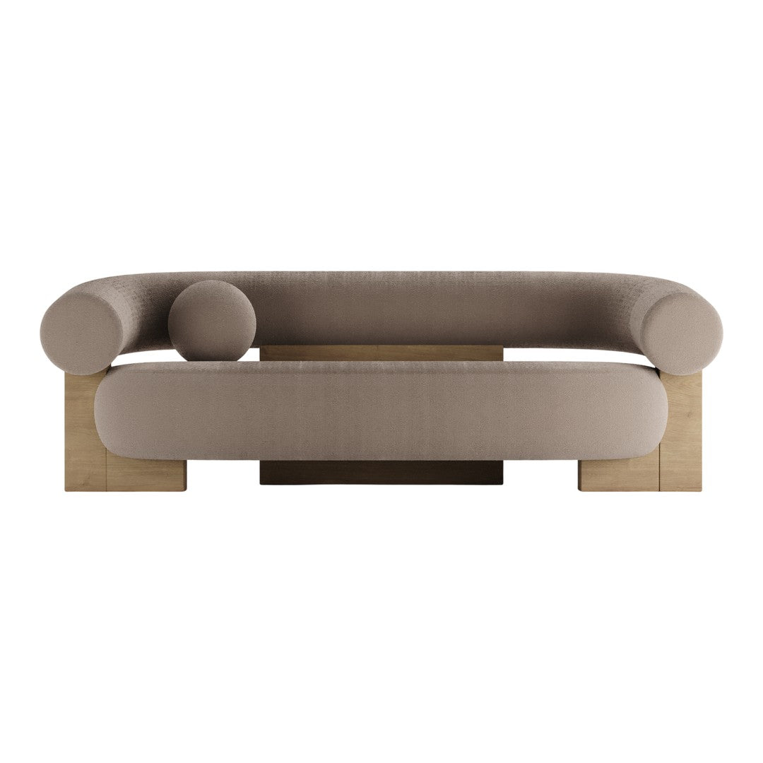 Beige curved sofa with round arms and a minimalist wooden base, perfect for modern living spaces.