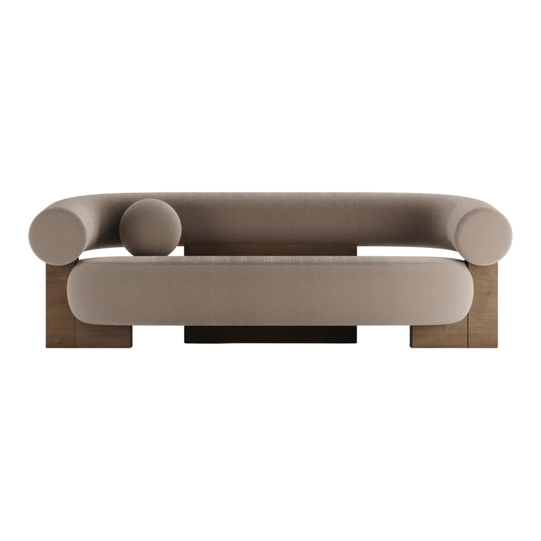 Contemporary beige sofa with rounded cushions and understated geometric patterns, featuring a sleek wooden base.