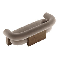 Curved beige sofa with soft fabric and a wooden base, featuring a minimalist modern design and smooth contours.