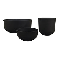 Set of three sleek, matte black bowls with smooth contours and minimalist design. Ideal for modern kitchen styling.