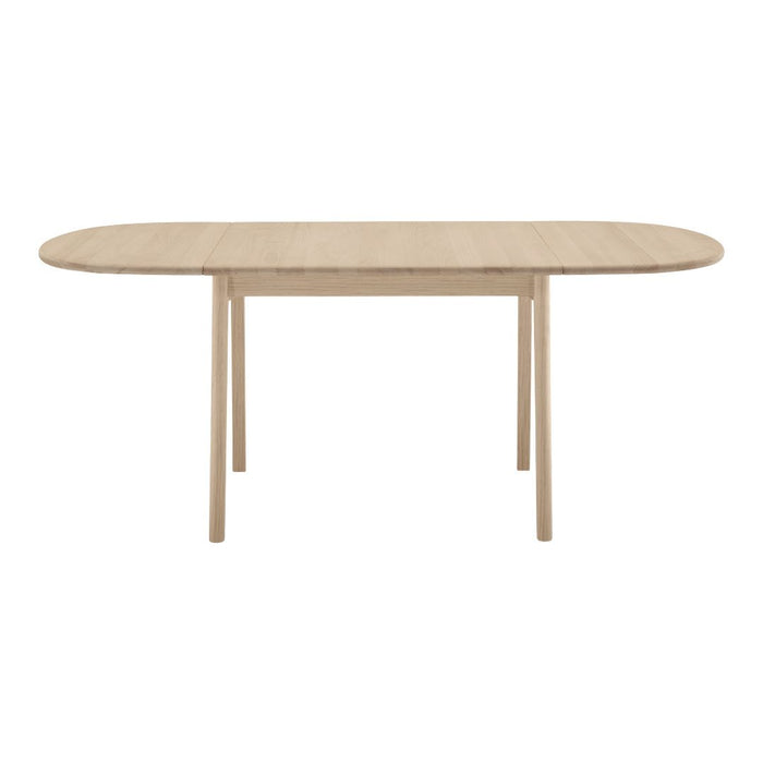 Light oak oval dining table with a smooth finish and natural wood grain pattern. Elegant and contemporary design.