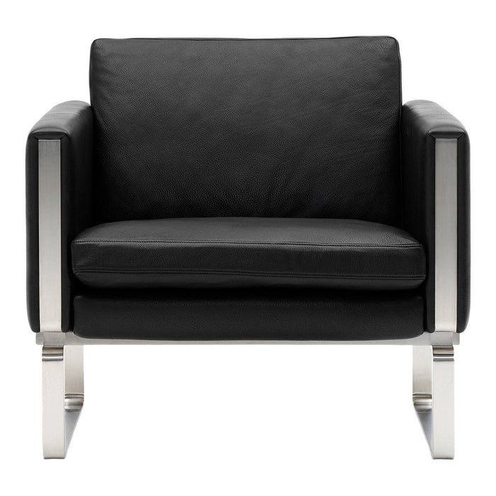 Black leather armchair with sleek silver metal legs and simple, modern design. Perfect for contemporary interiors.