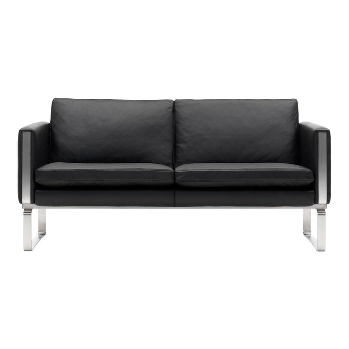 Black leather sofa with sleek silver accents and a minimalist design. Perfect for modern decor.