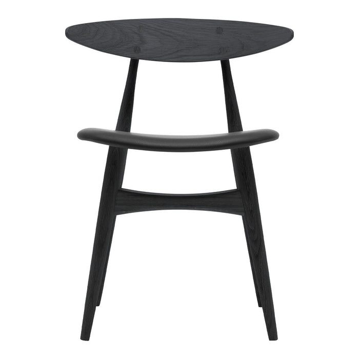 "Modern black wooden chair with smooth, sleek curves and an oval seat for a minimalist aesthetic."