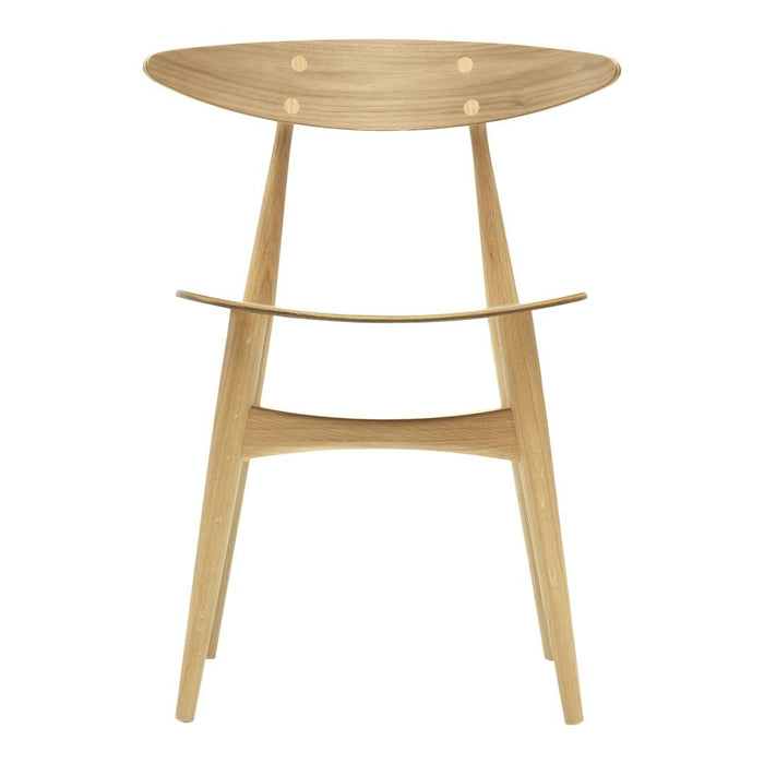 Light wooden stool with a minimalist design, featuring natural wood grain and smooth, rounded edges.