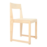 Light wood chair with a minimalist design and subtle natural grain pattern. Ideal for modern decor.