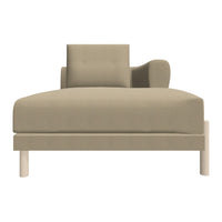 Beige chaise lounge with a textured pattern and minimalist design, featuring a single arm and loose cushion.