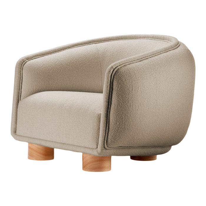 Beige textured armchair with rounded edges and natural wood legs, perfect for contemporary decor.
