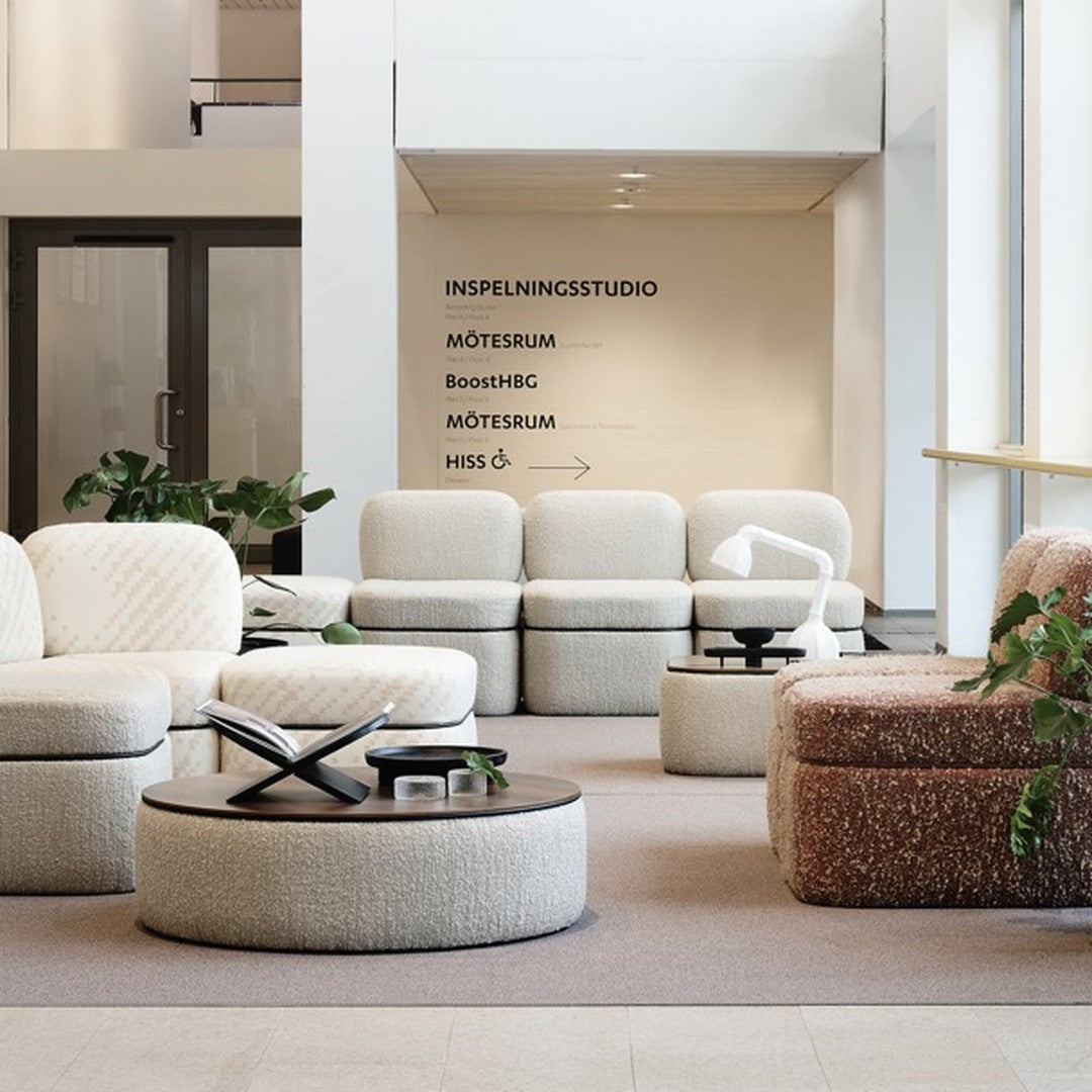 Modern seating with cream and beige fabrics; textured patterns and earthy tones create a stylish, inviting atmosphere.