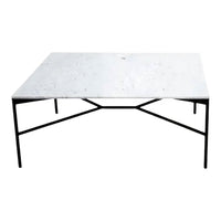 Modern rectangular coffee table with a white marble surface and sleek black metal legs. Perfect for contemporary decor.