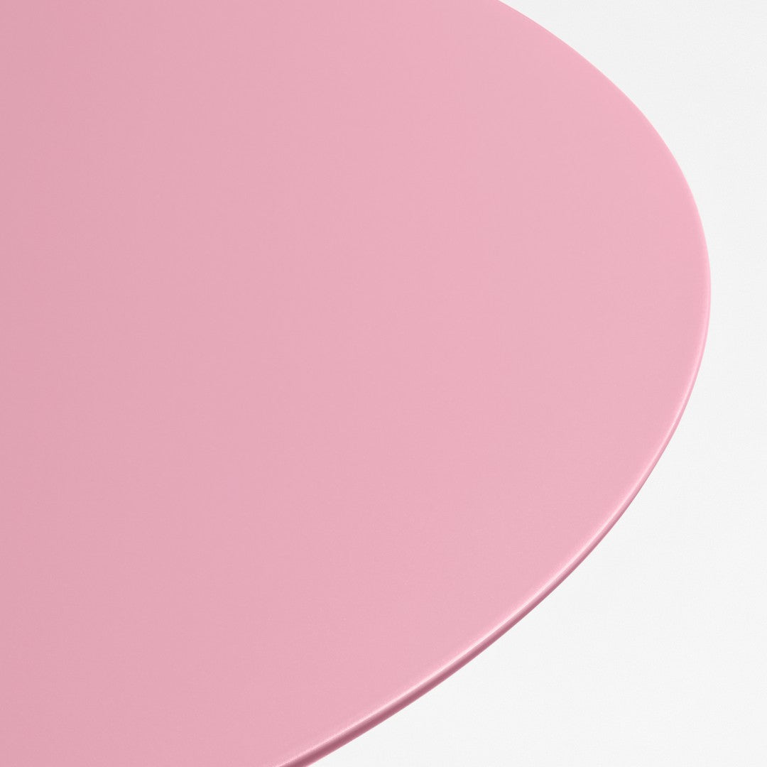 Round pink tabletop with a smooth, glossy finish against a white background. Ideal for modern decor.