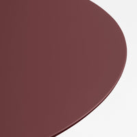 Deep burgundy circular tabletop with a smooth finish against a white background. Ideal for modern decor.