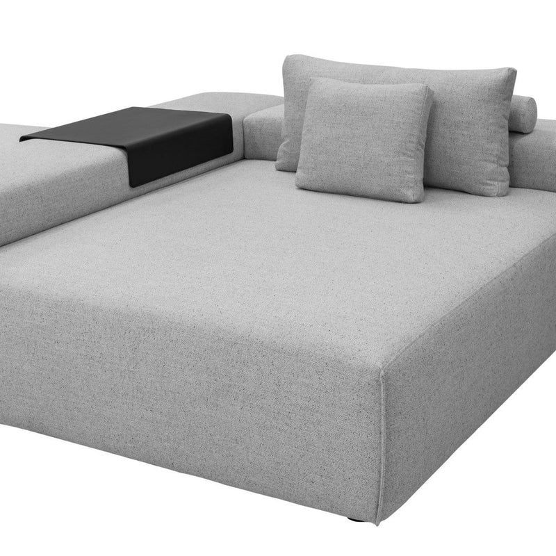 Gray fabric sectional sofa with a sleek black accent and coordinating throw pillows for a modern look.