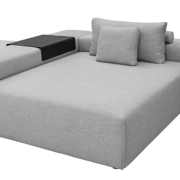 Grey fabric sectional sofa with minimalist design, featuring black accent details and plush pillows.