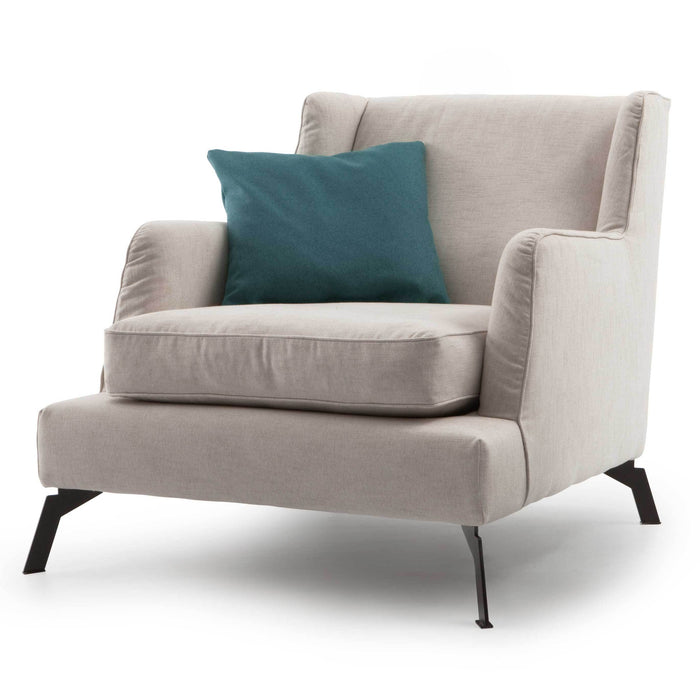 Light beige armchair with a teal cushion, featuring a minimalist design and sleek black legs.