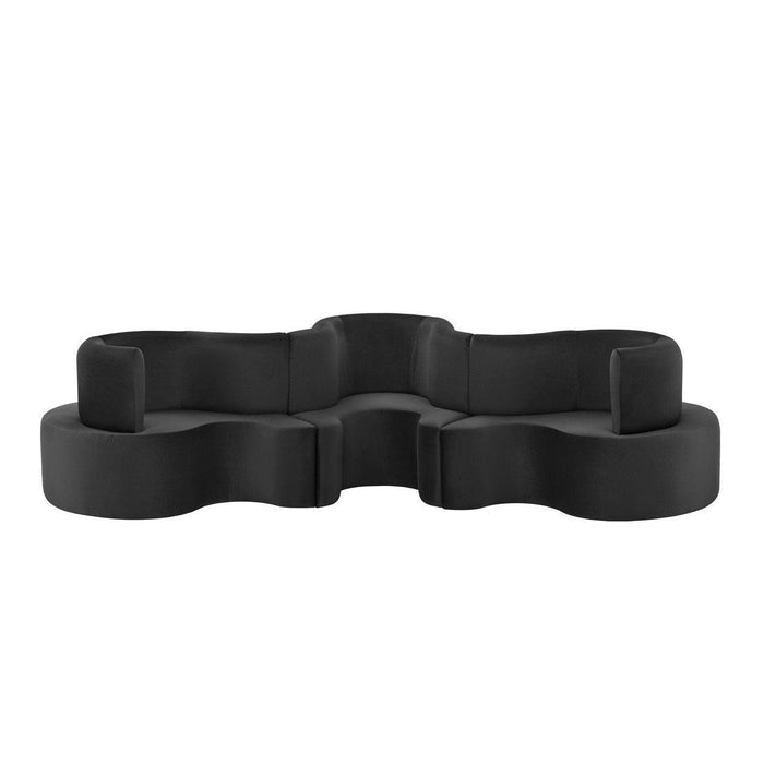 Stylish black modular sofa with smooth, curved shapes and a modern finish, perfect for contemporary decor.