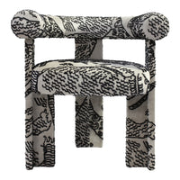 Black and white patterned upholstered chair with bold abstract design and rounded armrests. Perfect for modern decor.