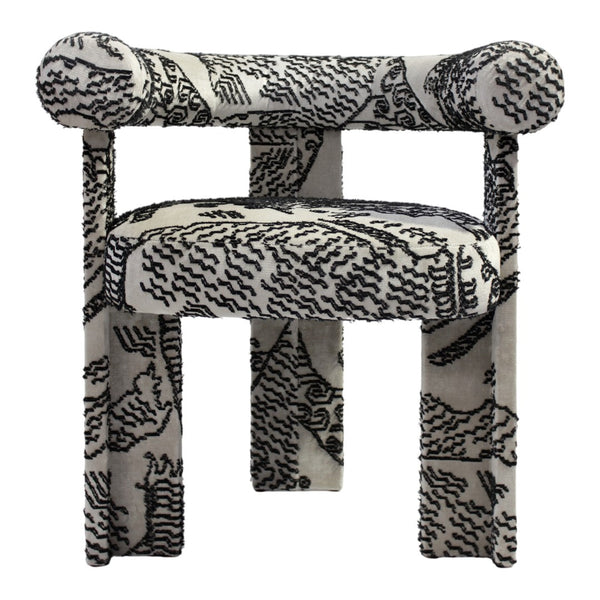 Black and white patterned upholstered chair with bold abstract design and rounded armrests. Perfect for modern decor.