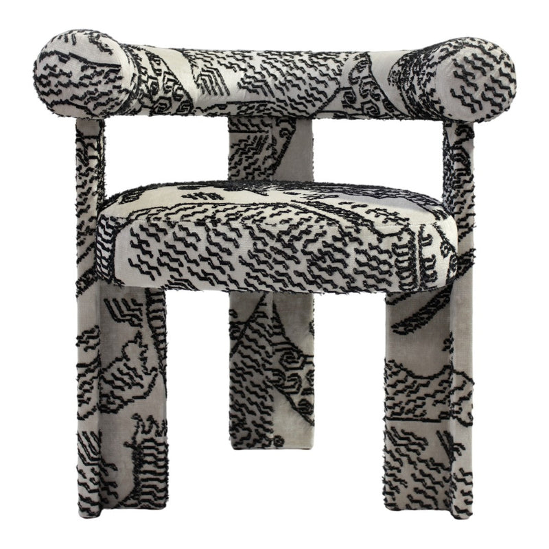 Black and white patterned upholstered chair with bold abstract design and rounded armrests. Perfect for modern decor.