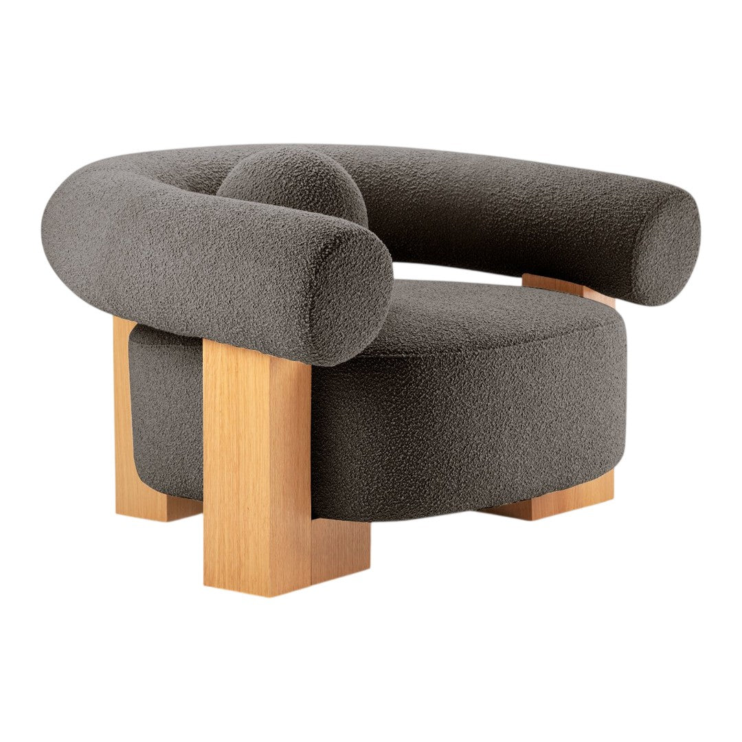 Gray upholstered chair with a rounded design and contrasting light wooden legs. Modern and minimalist style.