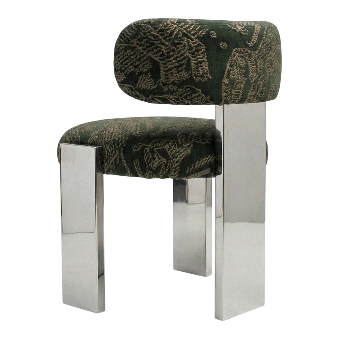 Green patterned upholstery with geometric designs on a modern chrome chair. Stylish and contemporary accent piece.
