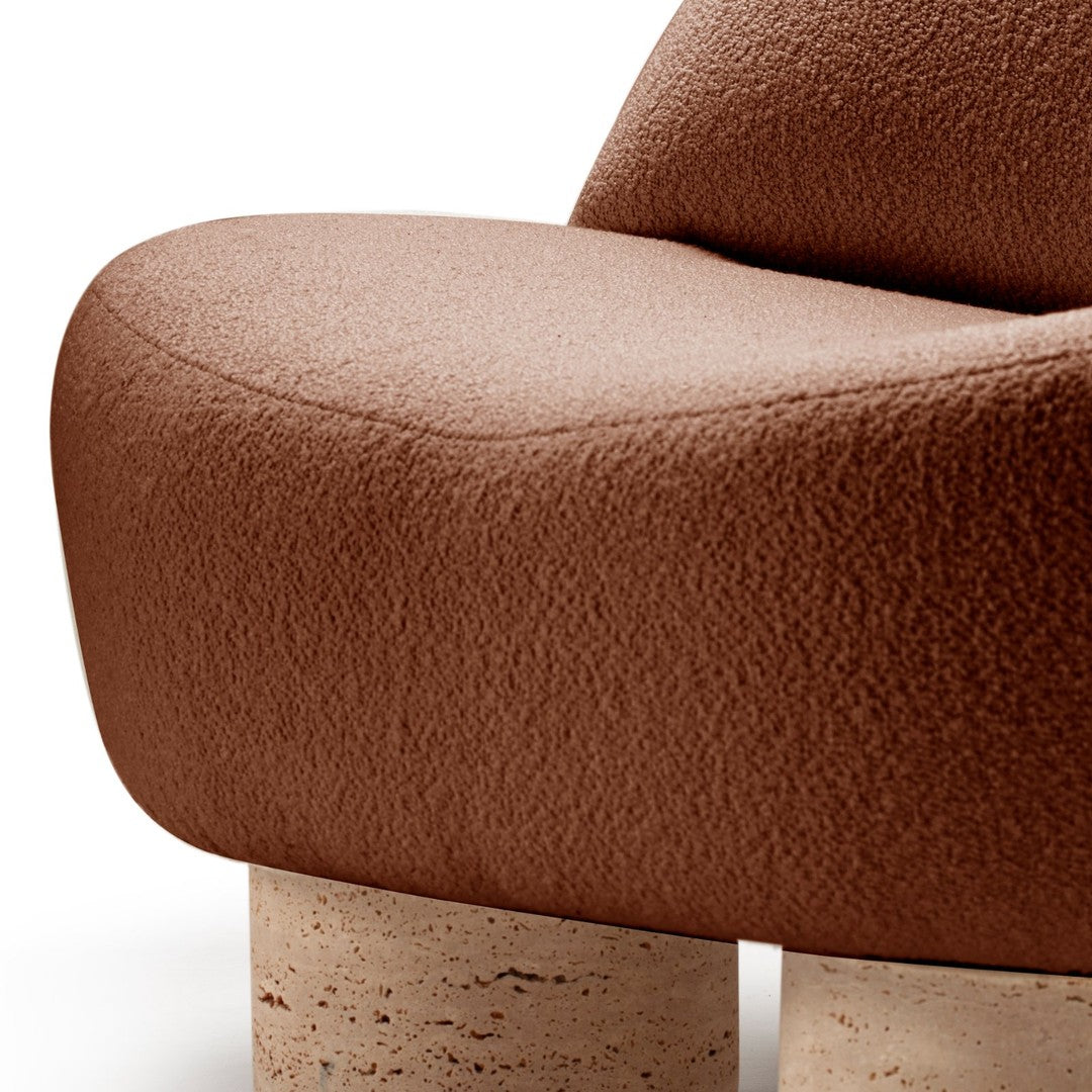 Brown textured upholstery with a smooth finish, paired with light cork legs, creating a modern aesthetic.