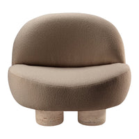 "Soft beige sofa with a rounded shape and textured fabric for a modern, cozy look."