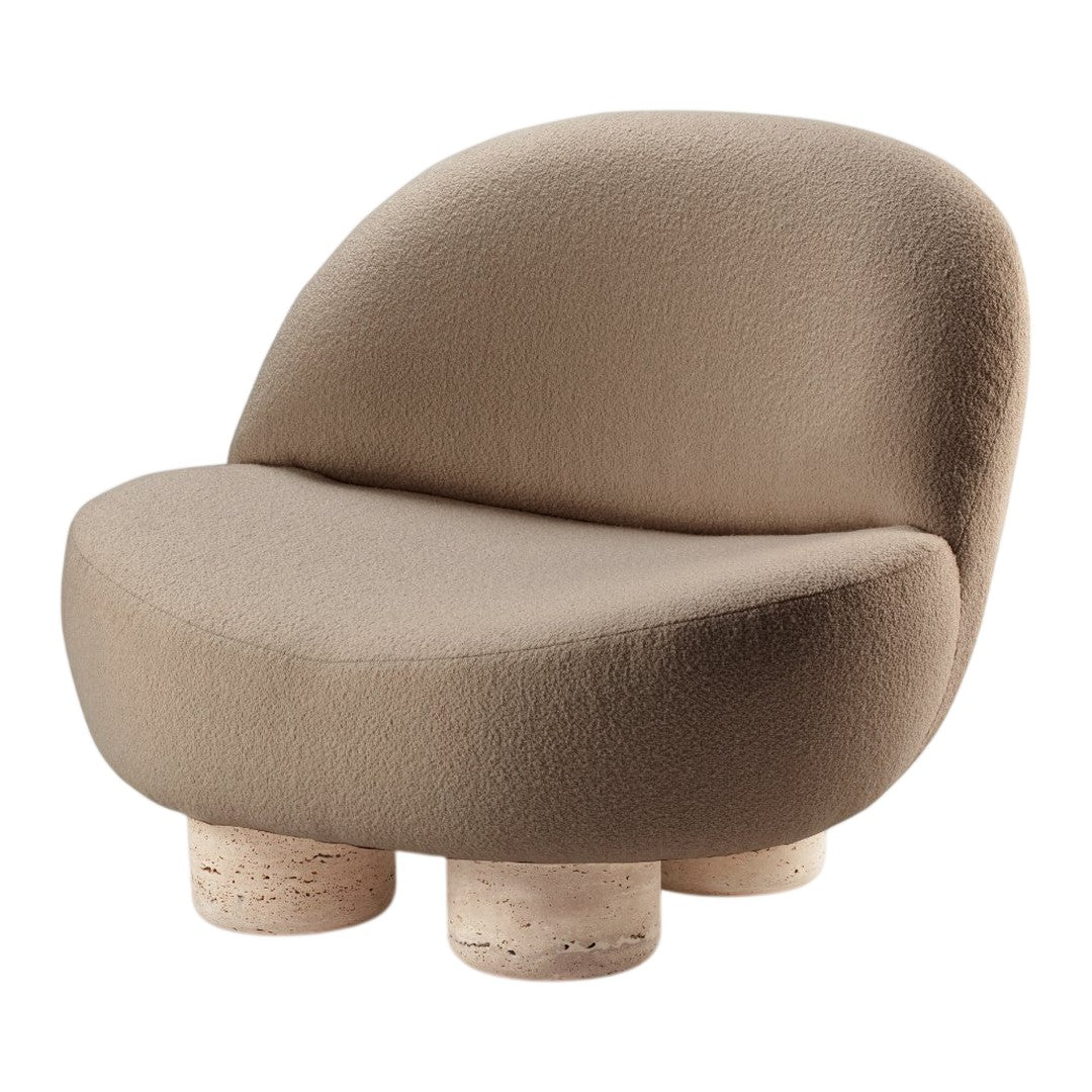 Soft beige chair with a rounded silhouette and textured fabric, resting on light, cylindrical stone legs.
