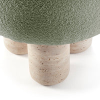 Green textured top with beige, speckled stone legs, featuring a natural earthy color palette and modern design elements.