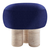 Navy blue upholstered stool with textured fabric and cylindrical beige stone legs. Modern design with minimalist style.