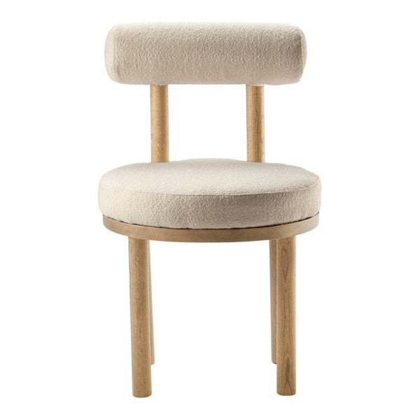 Beige upholstered chair with a round seat and cylindrical backrest, featuring natural wood legs. Soft, minimalist design.