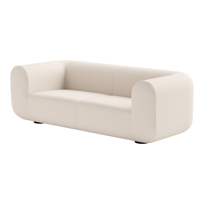 Cream-colored minimalist sofa with smooth, curved lines and a modern design. Perfect for contemporary living spaces.