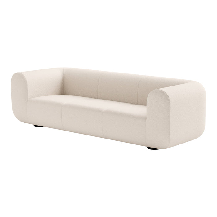 Modern cream upholstered sofa with smooth, minimalist design and rounded edges for a chic, contemporary look.