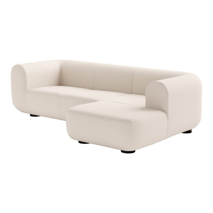 White upholstered modern sectional sofa with a minimalist design and smooth texture. Perfect for contemporary interiors.