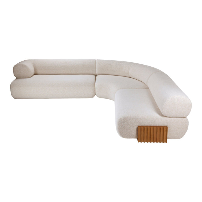 Curved cream sofa with soft texture, featuring a subtle pattern and wooden accent detail. Modern and elegant design.