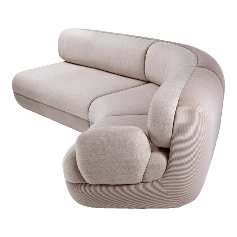 Beige sectional sofa with soft textured fabric and subtle ribbed accents for modern decor.