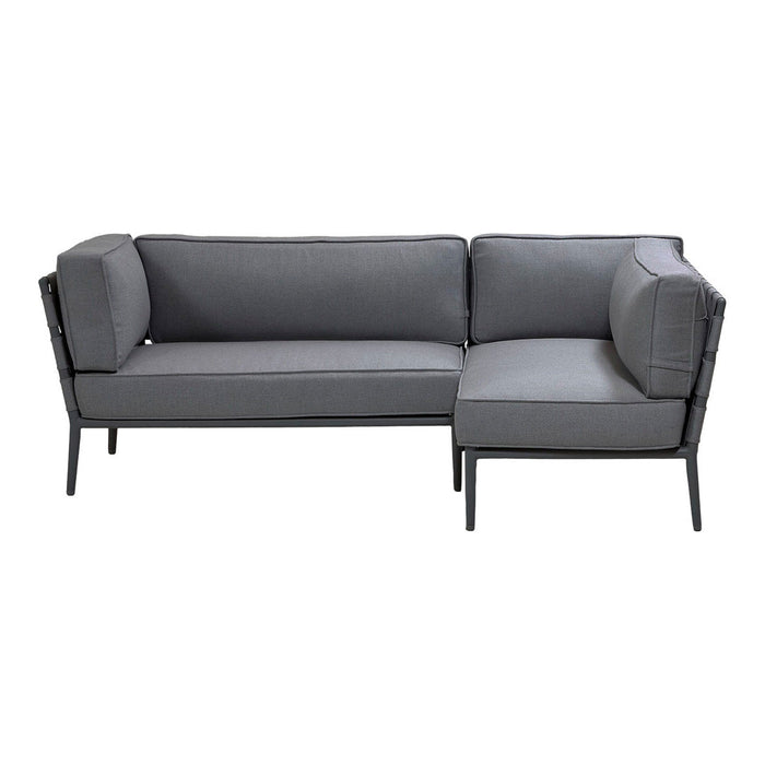 Gray sectional sofa with a sleek black frame and minimalist design, featuring smooth, solid fabric upholstery.