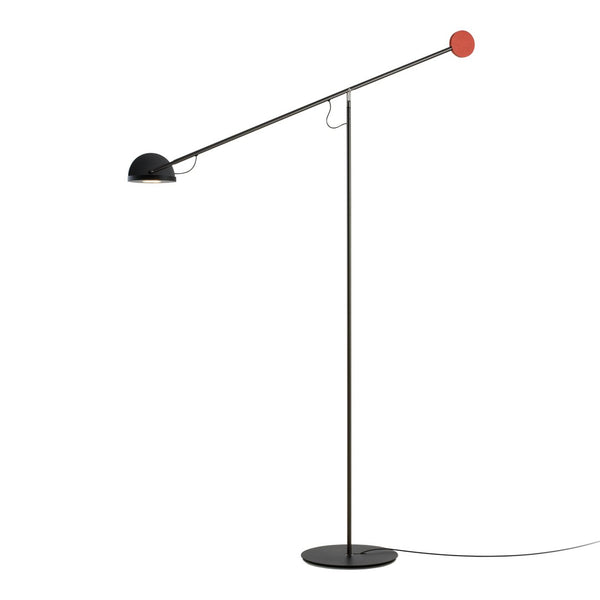 Modern floor lamp featuring a black base and shade with a bright red accent. Sleek, minimalist design perfect for contemporary decor.