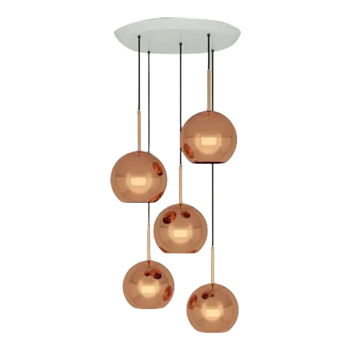 Copper spherical pendant lights with a sleek black and white ceiling mount. Modern design with reflective surfaces.