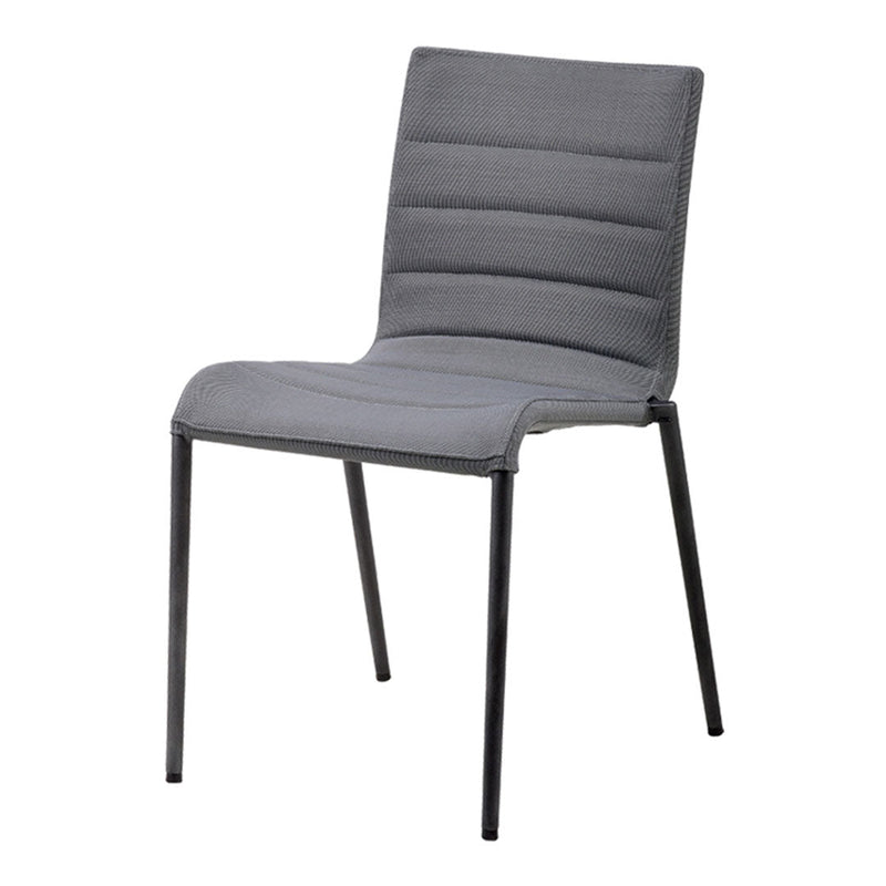 "Modern gray dining chair with a sleek ribbed design and black metal legs, perfect for contemporary spaces."