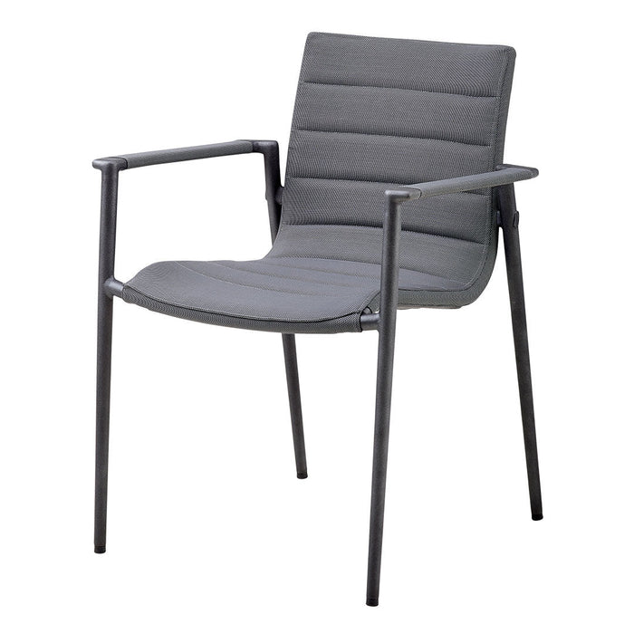 Gray upholstered chair with a sleek, modern design and horizontal ribbed pattern, complemented by black metal arms and legs.