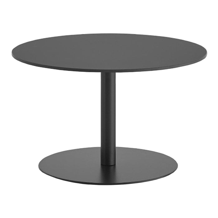 Black round table with a minimalistic design featuring a smooth surface and a sleek circular base.