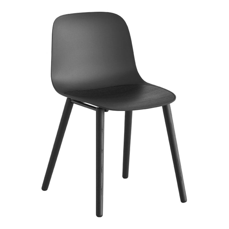 Black plastic chair with smooth, minimalist design and tapered wooden legs, perfect for modern decor.