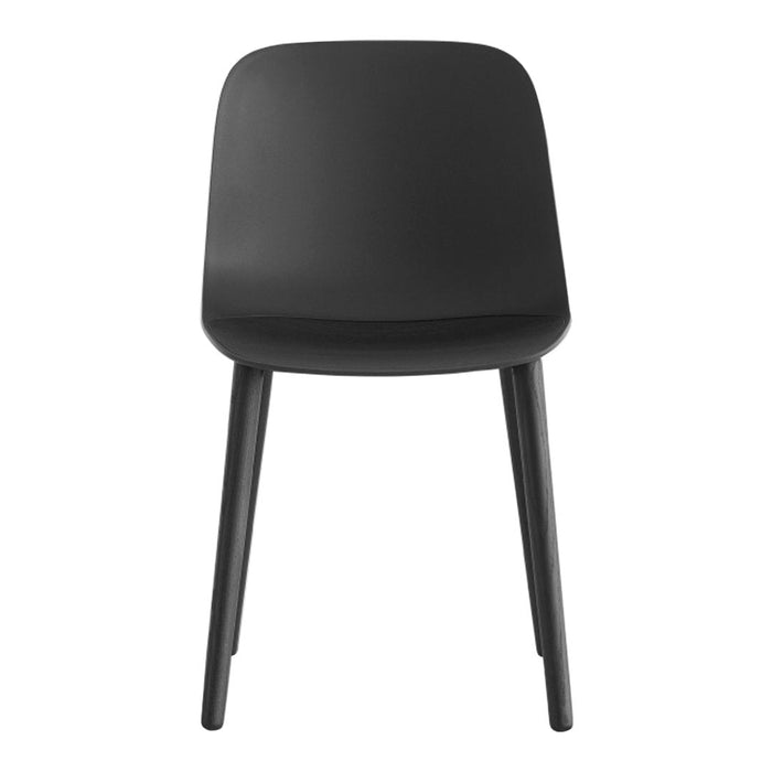 Modern black chair with a sleek, minimalist design and smooth, matte finish. Ideal for various decor styles.