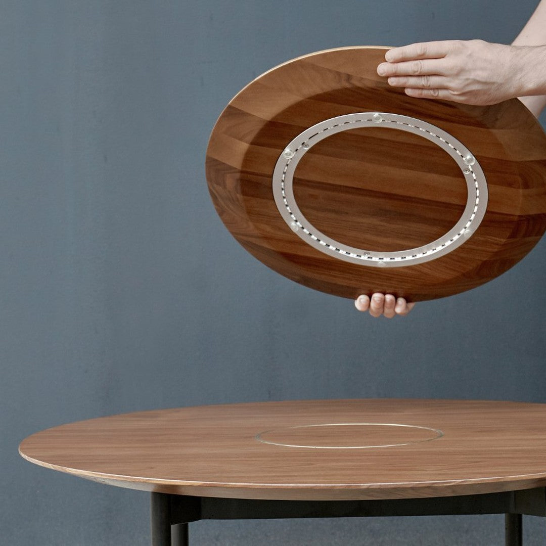 Wooden serving platter with a contrasting silver inlay, featuring rich brown tones and a smooth, polished finish.