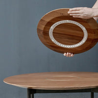 Wooden serving platter with a contrasting silver inlay, featuring rich brown tones and a smooth, polished finish.