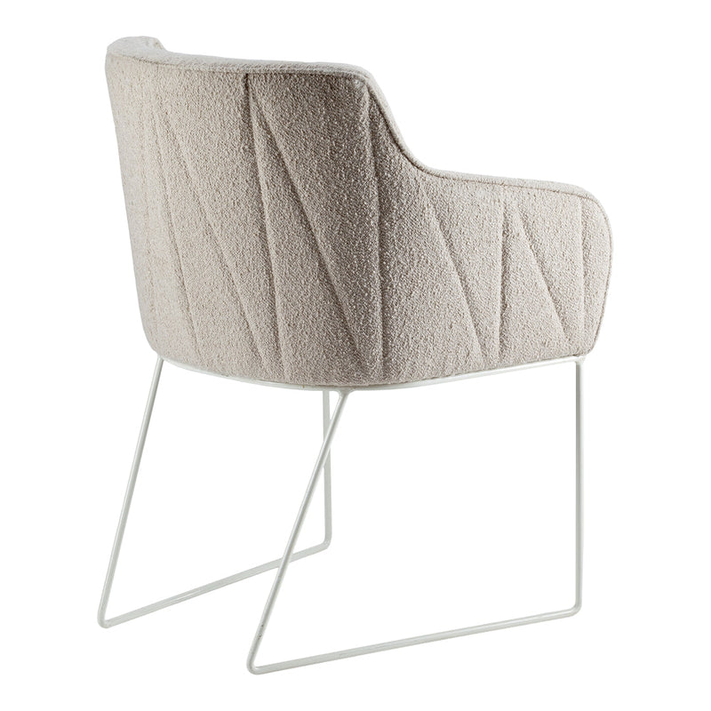 Beige textured dining chair with diagonal patterns and sleek white metal legs. Perfect for modern interiors.