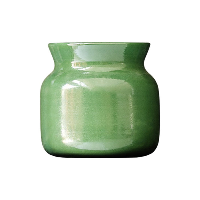 "Glossy green ceramic vase with a smooth, rounded design and subtle gradient finish."